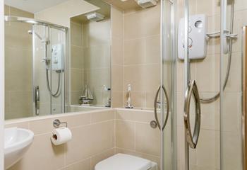 The en suite shower room benefits from an electric shower, perfect for invigorating yourself for the day ahead.