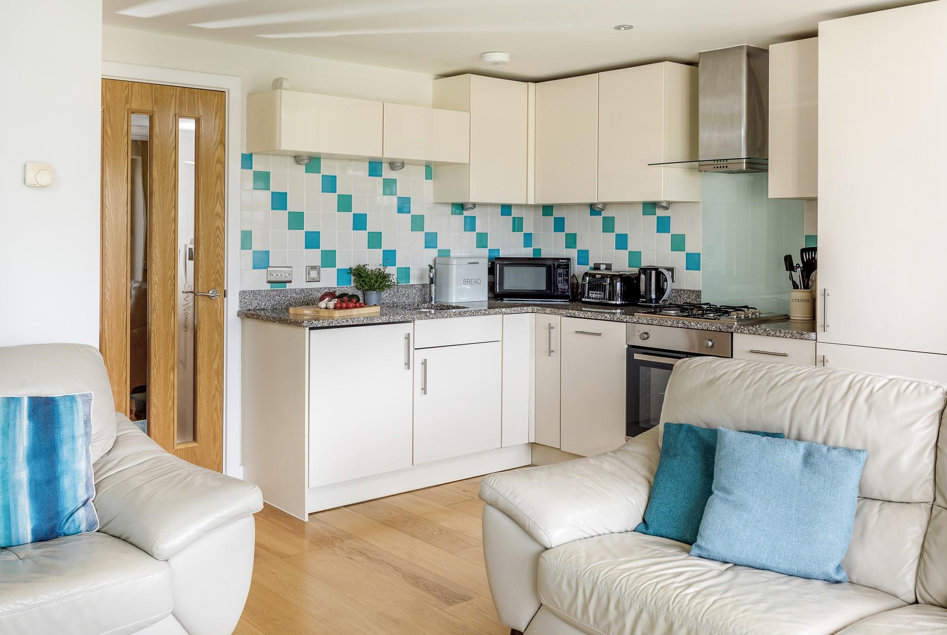 The open plan living area makes for a perfect place to spend some quality time with the family. 