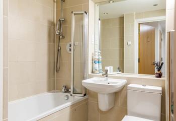 The family bathroom has a bath and shower over and a heated towel rail for warming up your towels. 