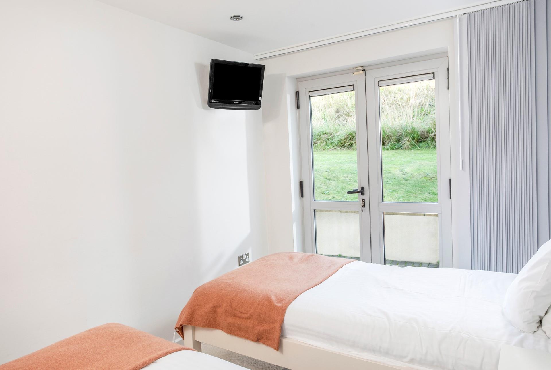 Step out of the twin room into the outside area to check the day's weather.