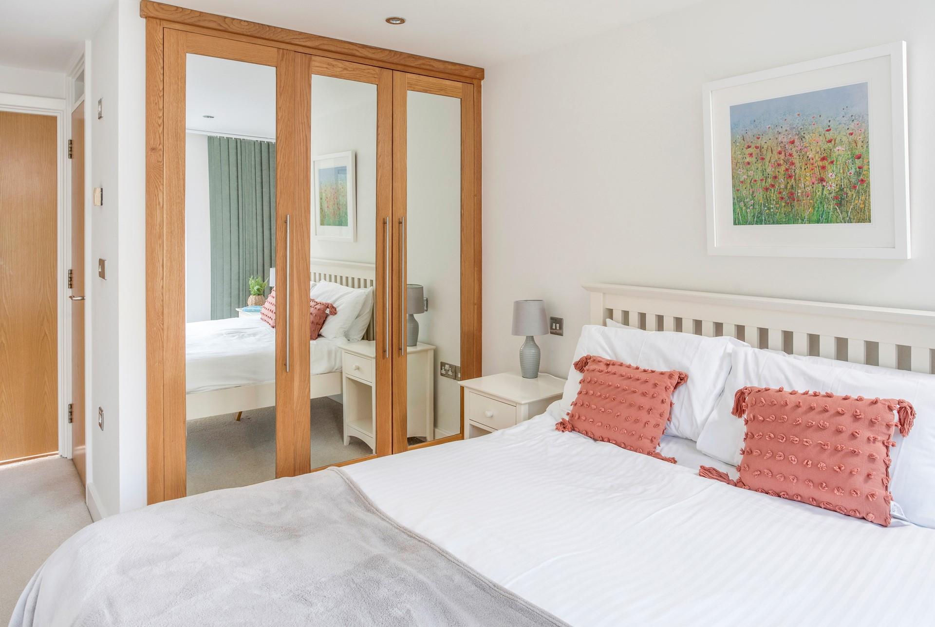 Bedroom 1 has a king size bed with doors to the outside area.