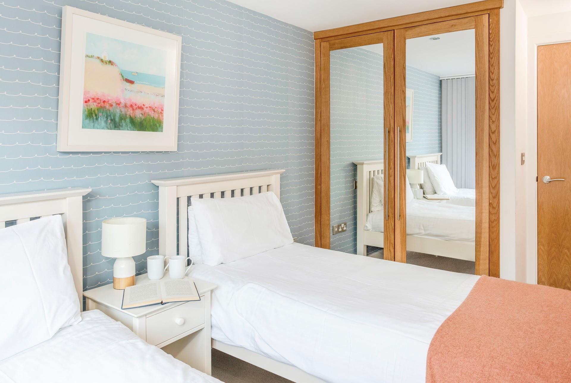 Settle into bed with a good book after a busy day on Porth beach.