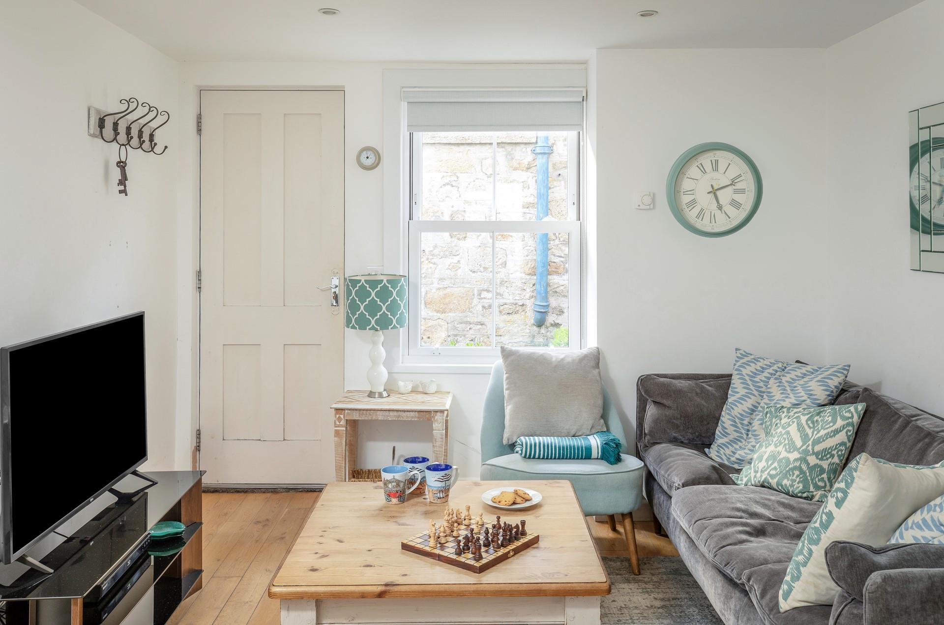 Classic furniture and calming colours have created a homely space.