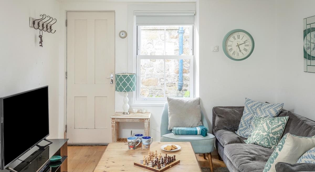Classic furniture and calming colours have created a homely space.