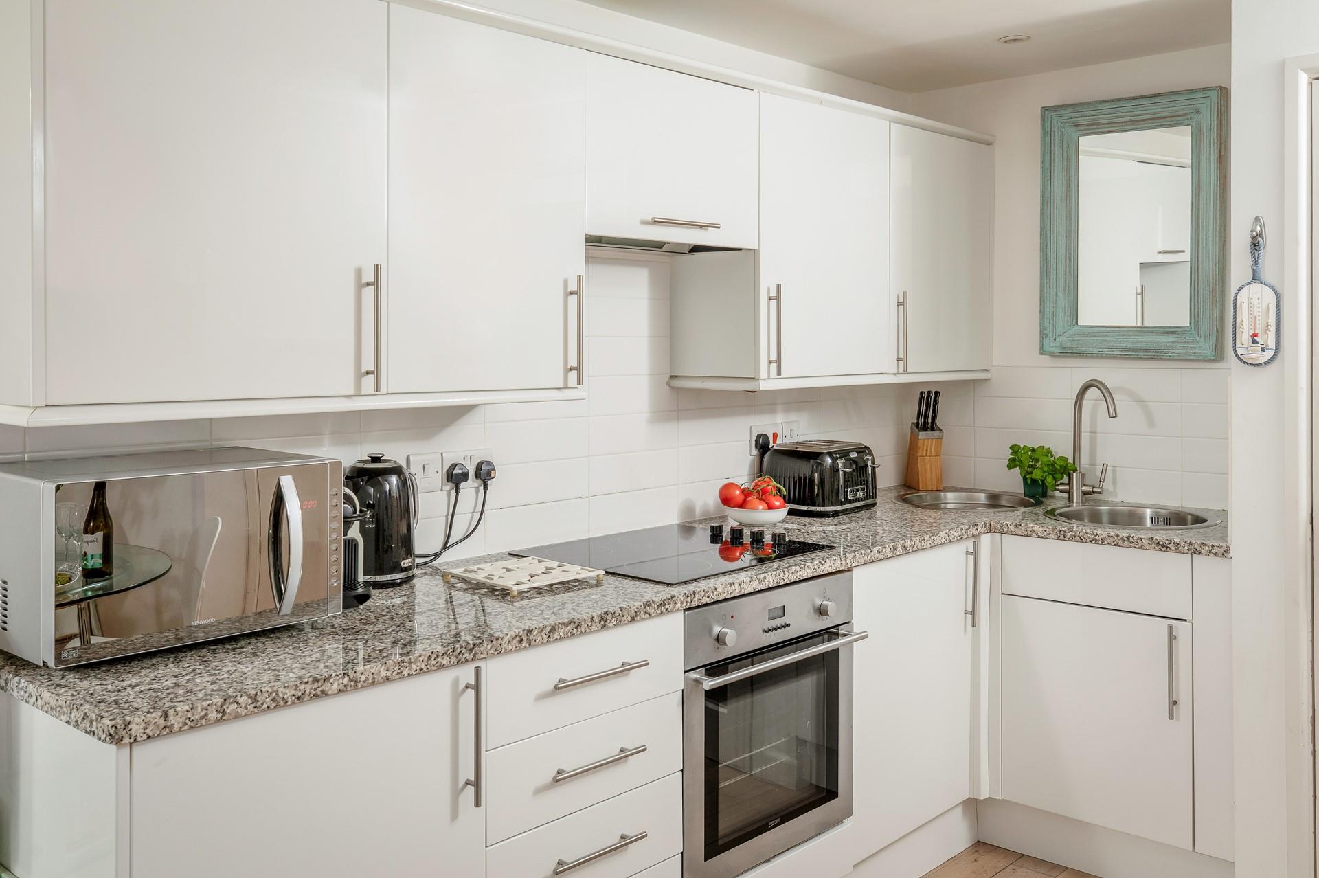 The stylish kitchen makes it easy to whip up delicious home-cooked meals.