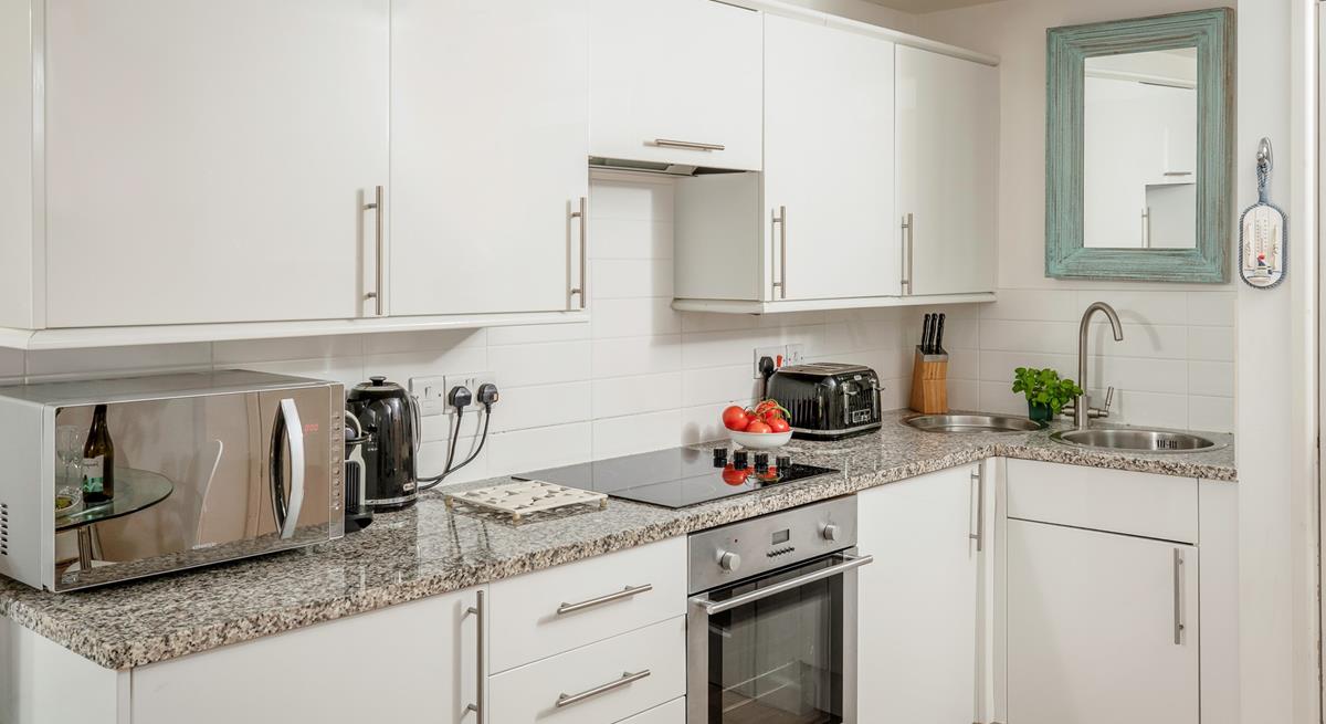 The stylish kitchen makes it easy to whip up delicious home-cooked meals.