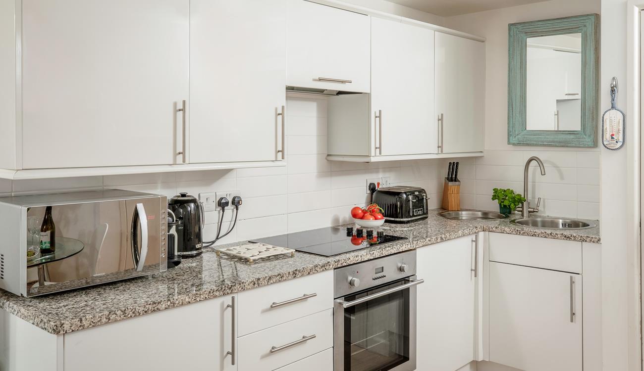 The stylish kitchen makes it easy to whip up delicious home-cooked meals.