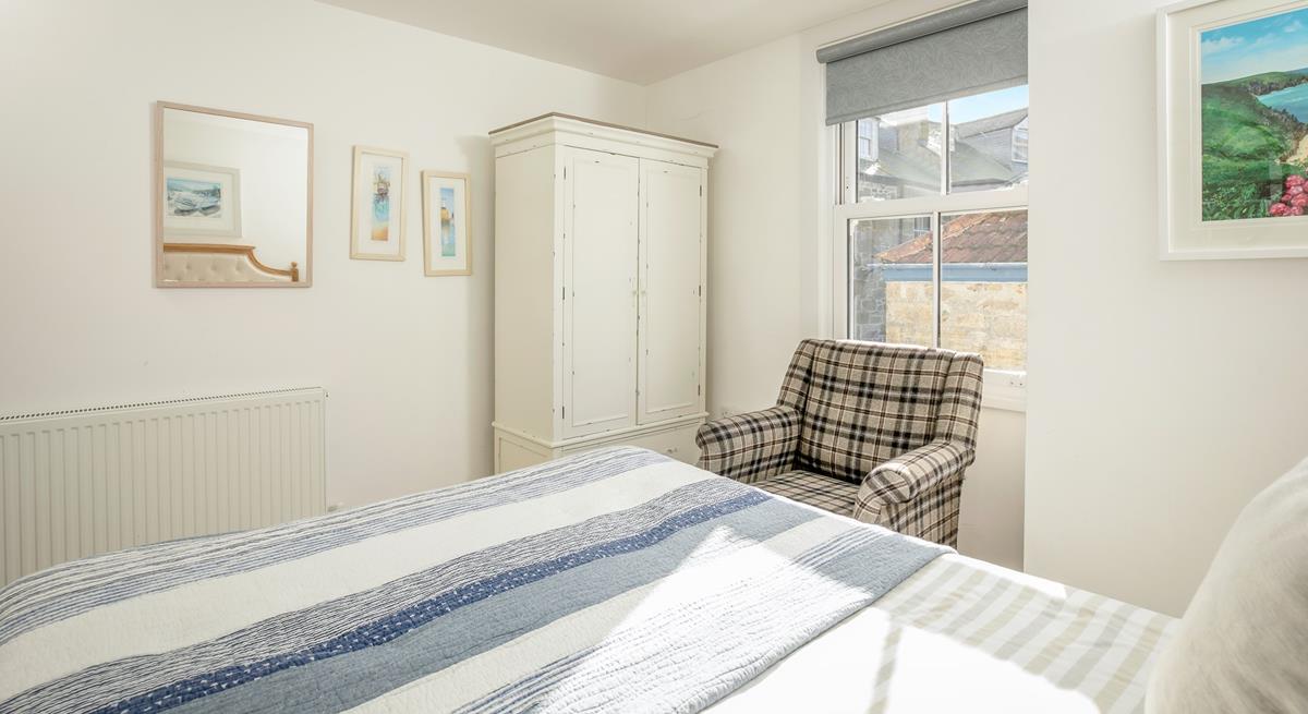 The comfortable bed promises a peaceful night's sleep.