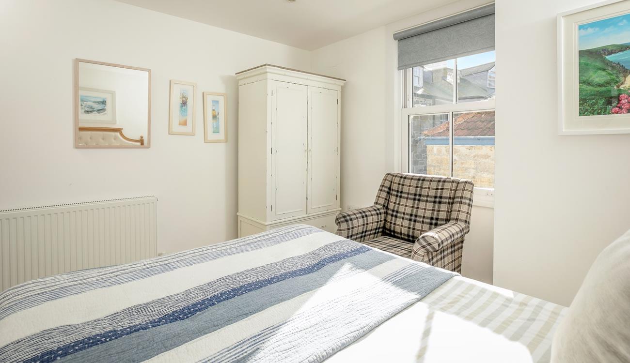 The comfortable bed promises a peaceful night's sleep.