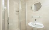 The bathroom benefits from a spacious double shower. - Thumbnail Image