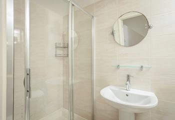 The bathroom benefits from a spacious double shower.