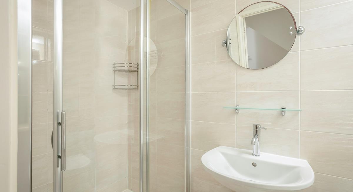 The bathroom benefits from a spacious double shower.
