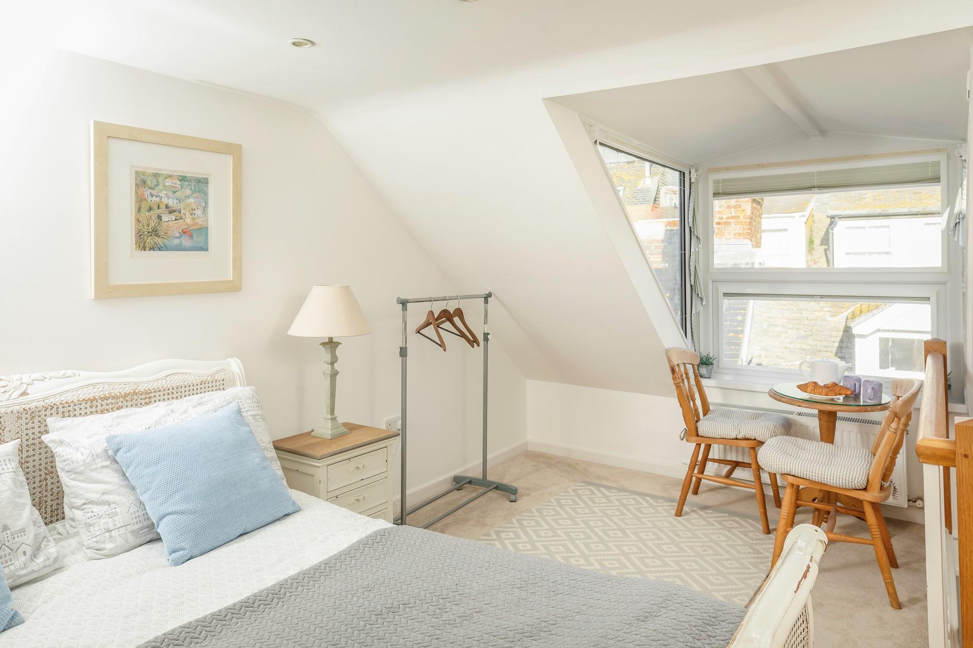 The seating in the king size bedroom is perfect for tucking yourself away and getting lost in a good book.