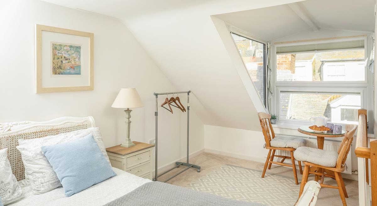 The seating in the king size bedroom is perfect for tucking yourself away and getting lost in a good book.