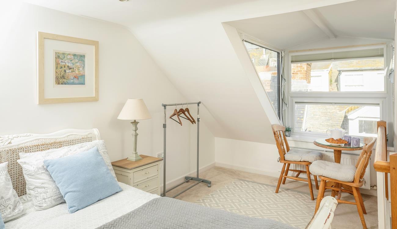 The seating in the king size bedroom is perfect for tucking yourself away and getting lost in a good book.