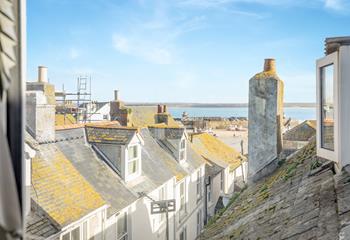 Gaze out over the iconic rooftops to the harbour and the sea in the distance. 