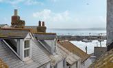 Gaze out over the iconic rooftops to the harbour and the sea in the distance.  - Thumbnail Image