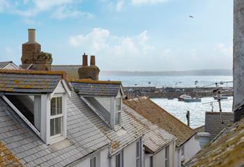 Gaze out over the iconic rooftops to the harbour and the sea in the distance. 