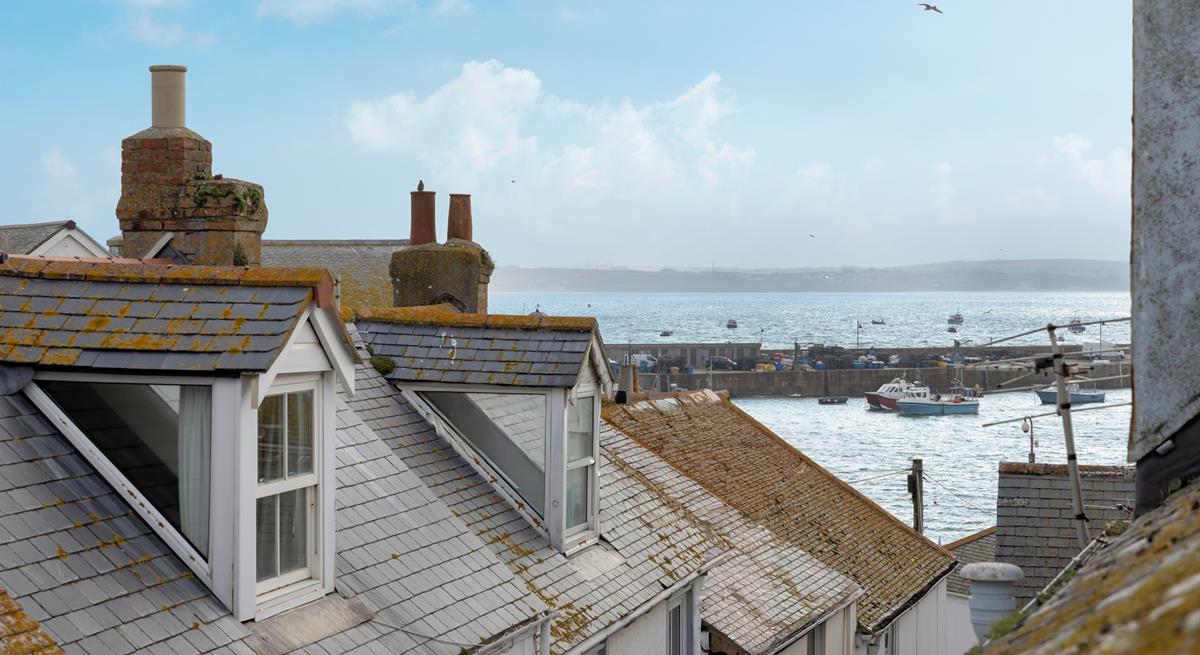 Gaze out over the iconic rooftops to the harbour and the sea in the distance. 