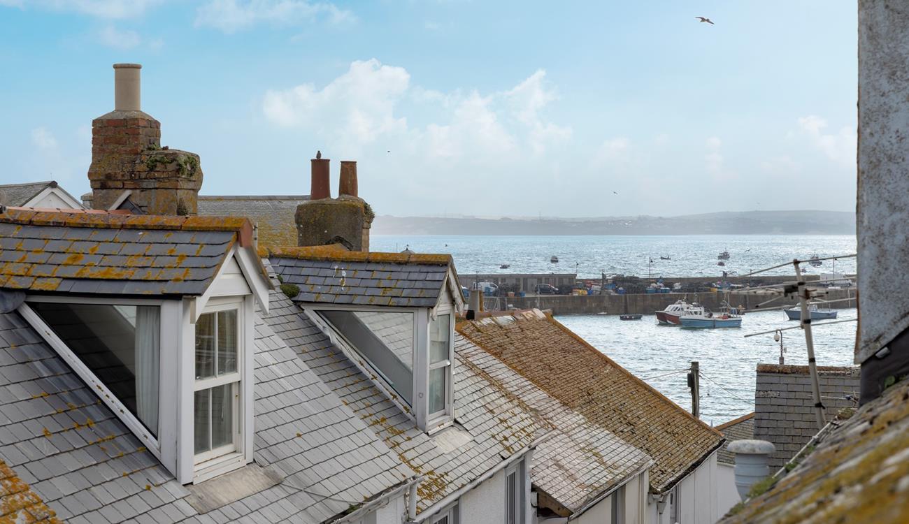 Gaze out over the iconic rooftops to the harbour and the sea in the distance. 
