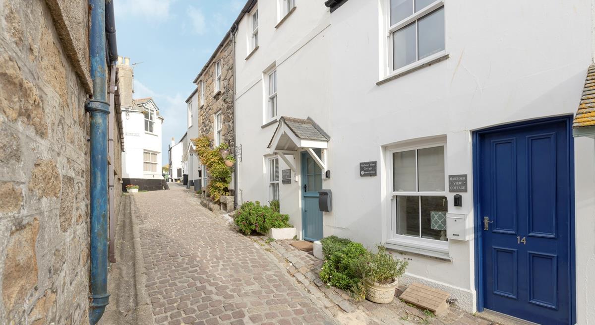 Wander the cobbled lanes of Downalong in this quaint town.