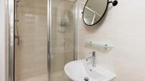 The bathroom benefits from a spacious double shower.