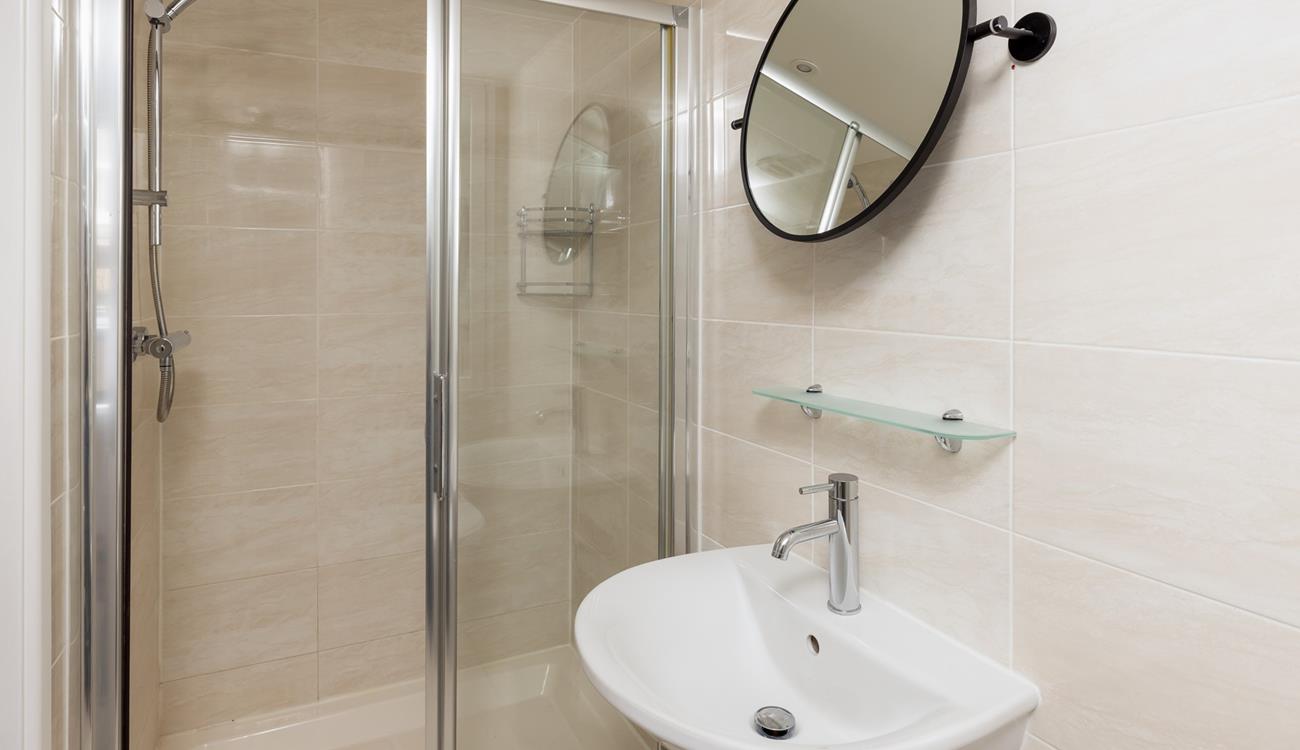 The bathroom benefits from a spacious double shower.