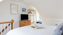 Watch tv from the comfort of bed after a day of exploring. 