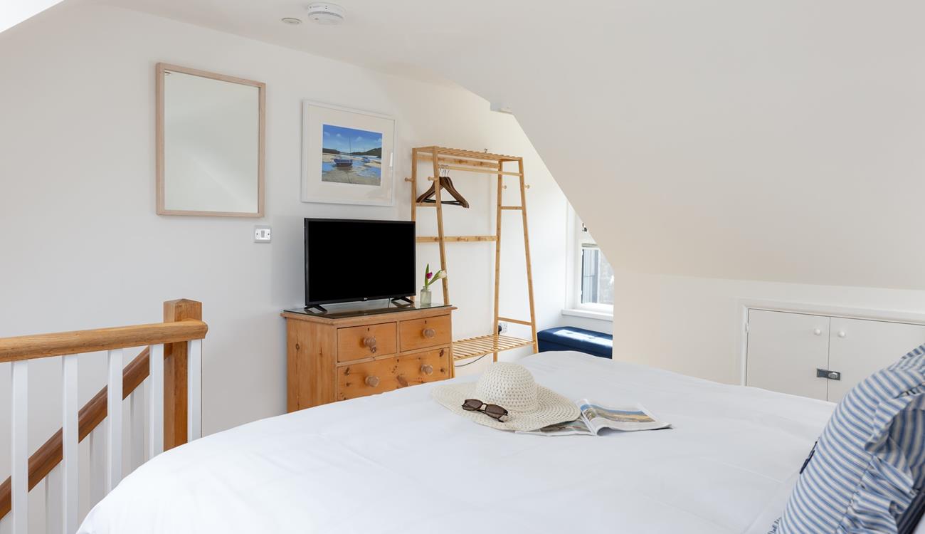 Watch tv from the comfort of bed after a day of exploring. 