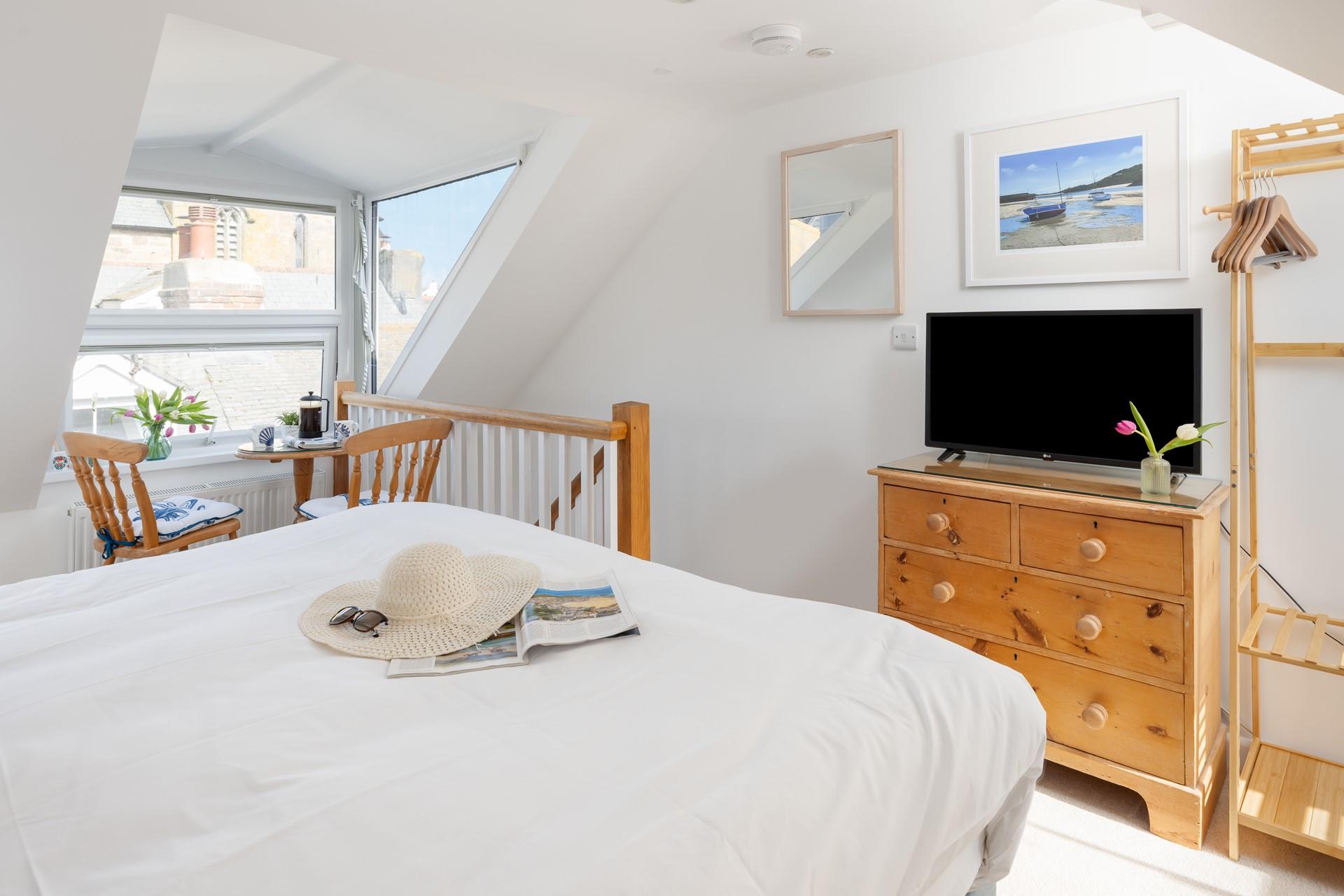 Watch some tv in bed after a busy day walking the streets of St Ives.