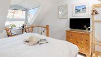 Watch some tv in bed after a busy day walking the streets of St Ives.