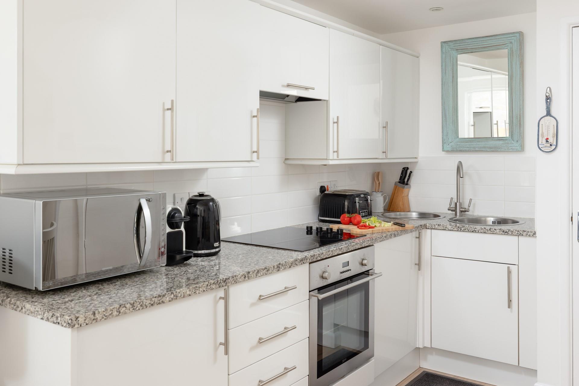 The stylish kitchen makes it easy to whip up delicious home-cooked meals.