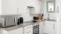 The stylish kitchen makes it easy to whip up delicious home-cooked meals.