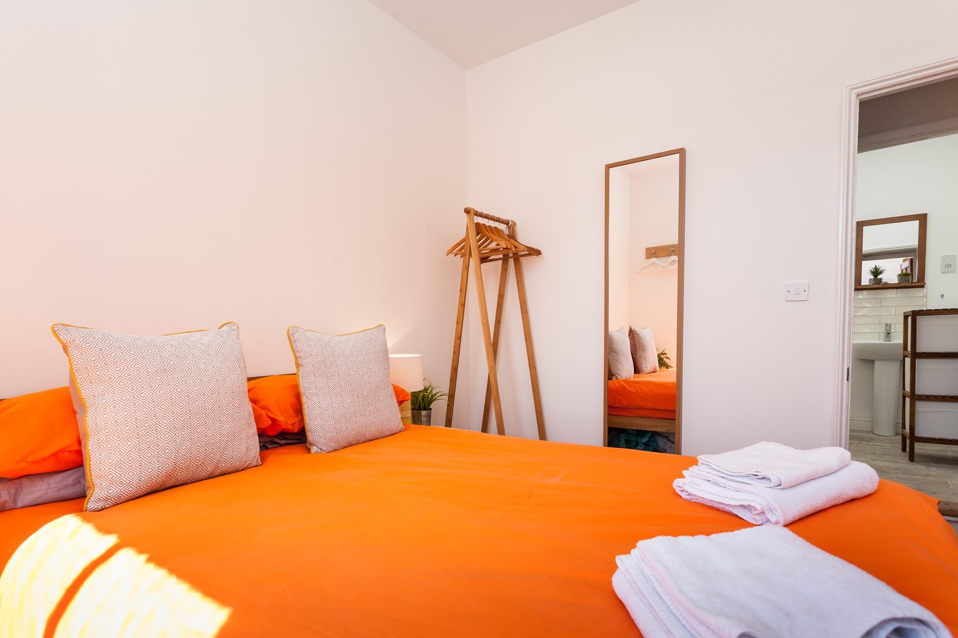 The comfortable bed promises a good night's sleep in the soft sheets.