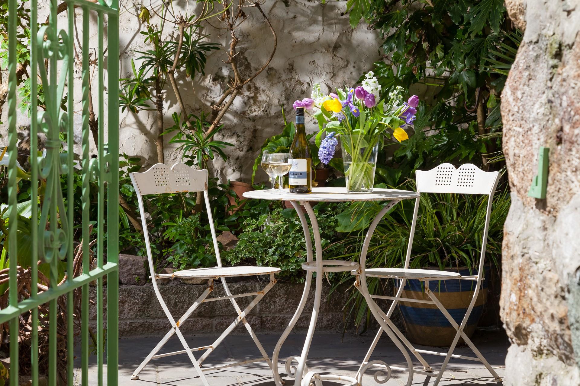 Pour yourself a glass of something chilled and soak up the sun in the enclosed courtyard. 