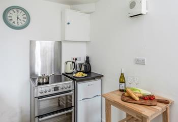 The kitchen is a functional space with plenty of worktops available for you to rustle up some fine meals.