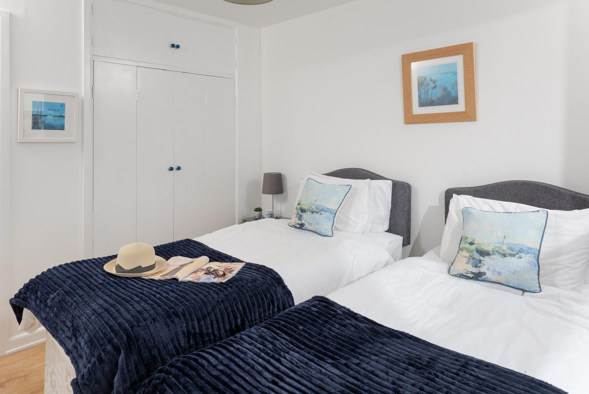 A built-in cupboard provides ample storage for your belongings.