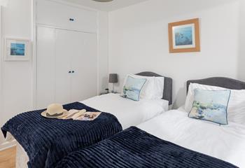 A built-in cupboard provides ample storage for your belongings.