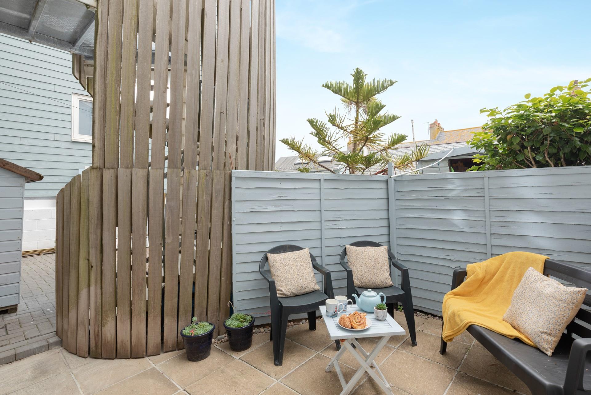 Soak up the sun each morning on the patio.