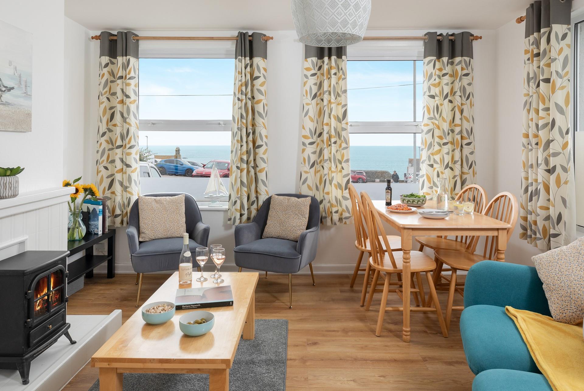 The living area has contemporary furniture and a tasteful use of colour.