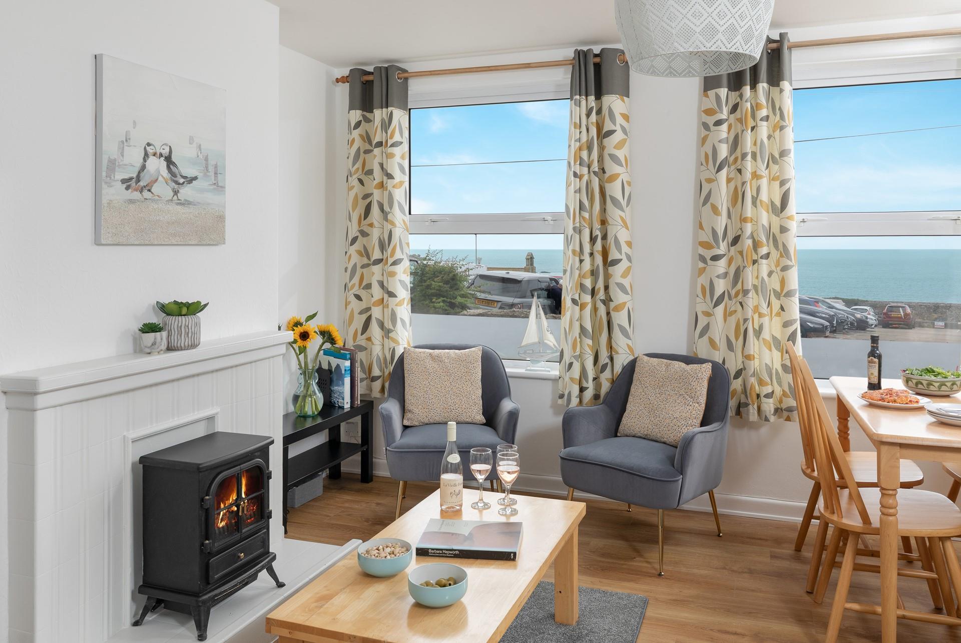 There's an electric fire, two armchairs and a small selection of books, all the ingredients you need for a cosy evening. 