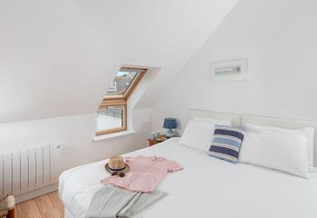 Crisp white linen invites you to snuggle down and drift off.