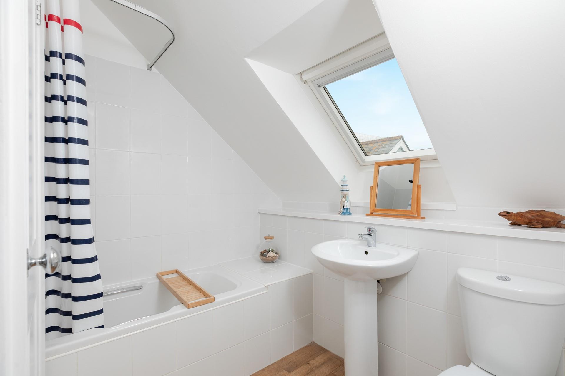 The bathroom is modern and the ideal space for getting ready each day.