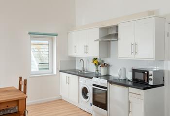 Compact but very well-equipped, the kitchen makes whipping up delicious meals a breeze.