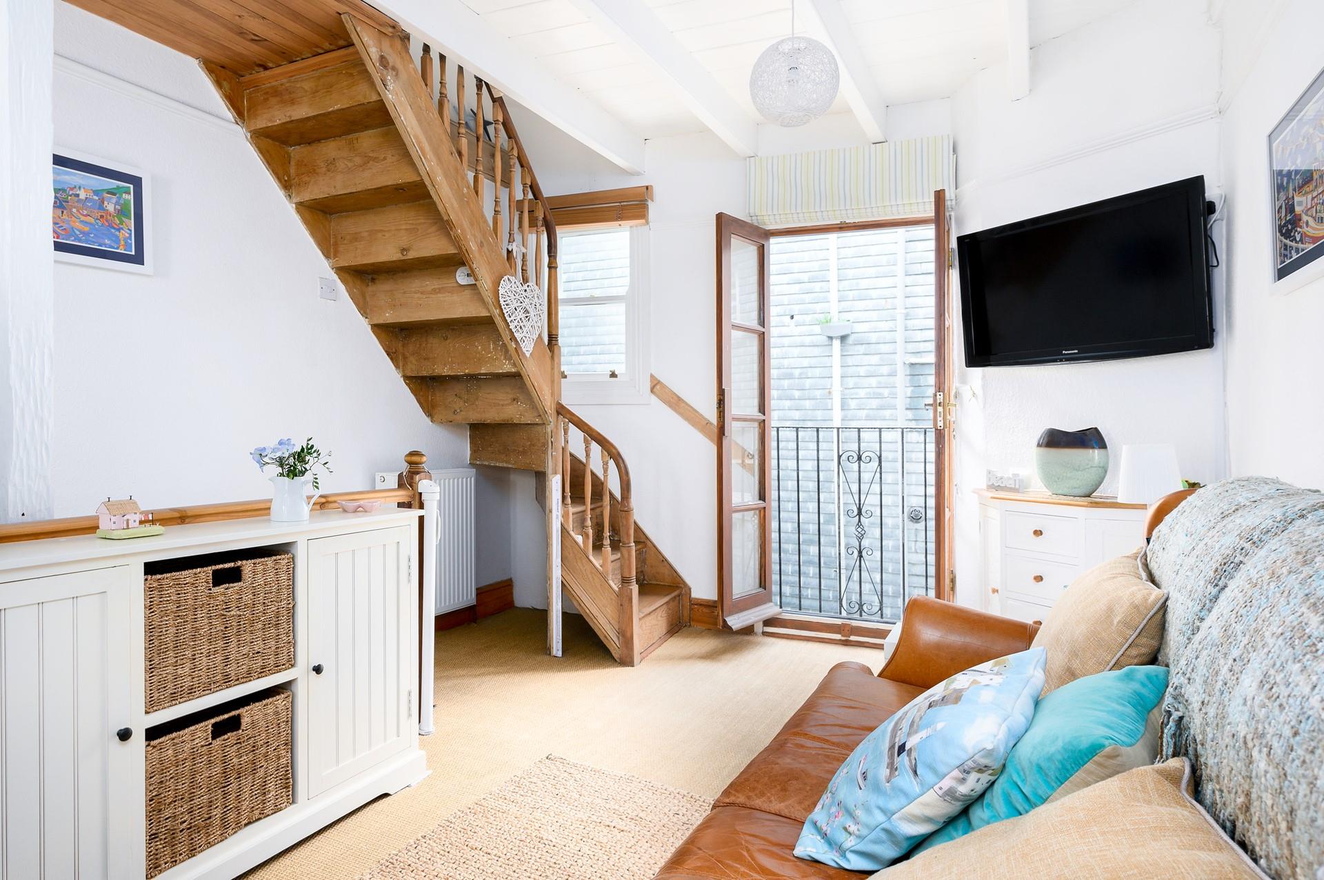 The quirky Juliette balcony means you can let the fresh summer breeze run through the cottage.