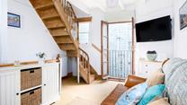 The quirky Juliette balcony means you can let the fresh summer breeze run through the cottage.