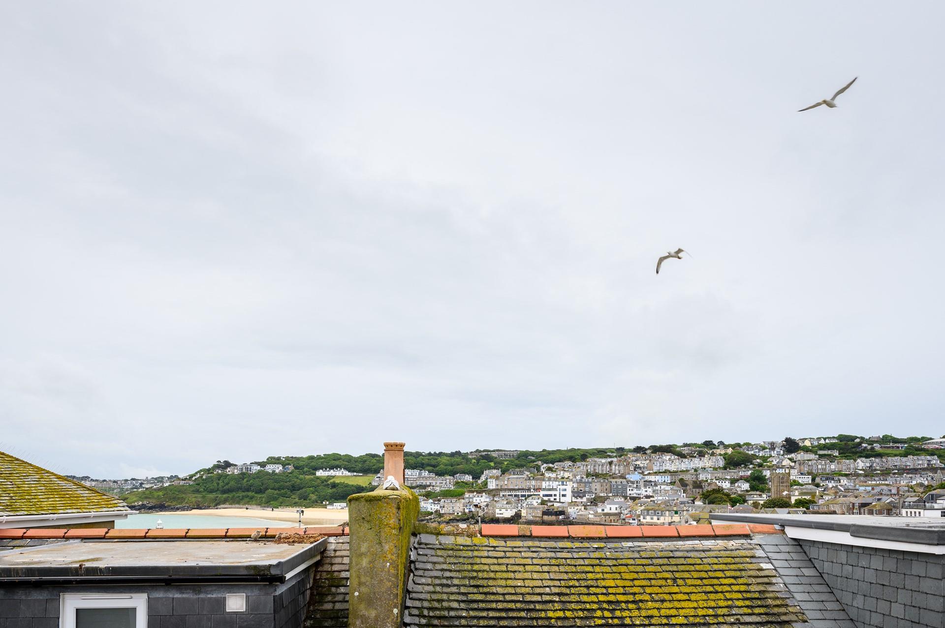 You can catch a glimpse of the sea over St Ives quirky rooftops.