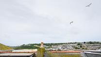 You can catch a glimpse of the sea over St Ives quirky rooftops.