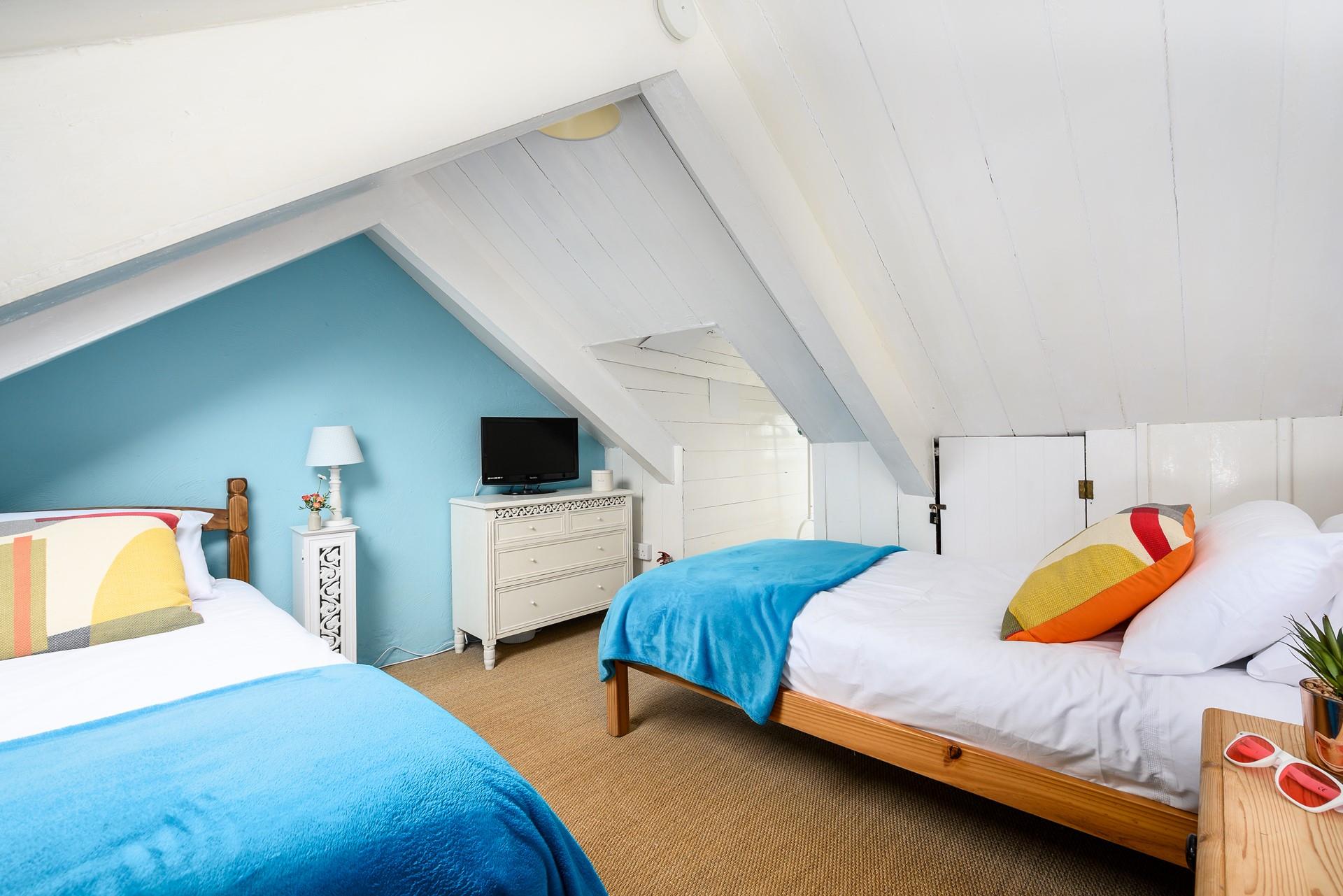 The attic room has twin beds for snuggling up after days spent adventuring.