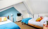 The attic room has twin beds for snuggling up after days spent adventuring. - Thumbnail Image